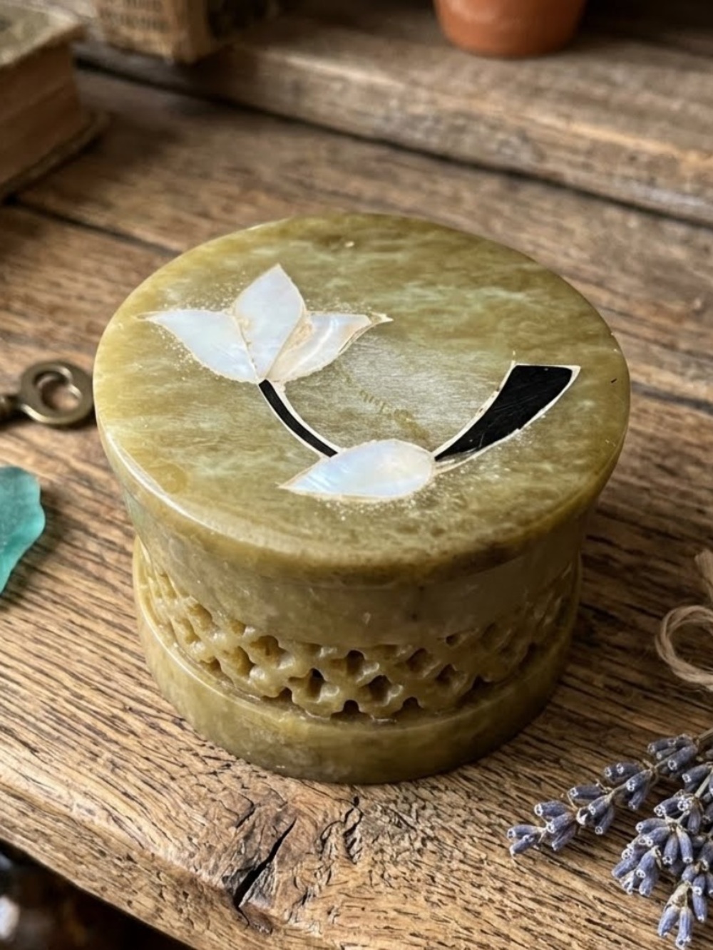 Vintage hand-carved olive-green soapstone trinket or pill box
Floral inlay